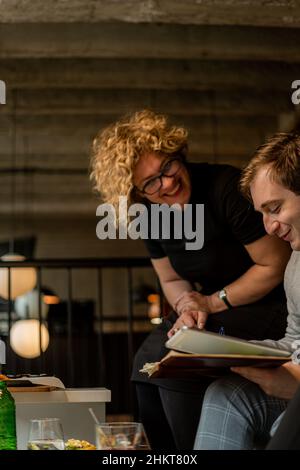 Amazing and beautiful business people are smiling and working on the project Stock Photo