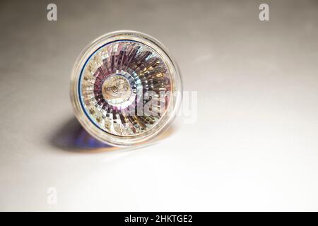 Close up of a halogen spotlight on a blurred surface, selective focus, halogen bulb, 50W, low energy efficiency, copy space Stock Photo