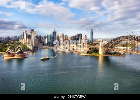 Waterfront architectural landmarks of Sydney city CDB around Circular quay and the Rocks on shores of Harbour in aerial cityscape. Stock Photo