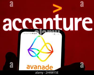 In this photo illustration, the Avanade logo is displayed on a smartphone screen with a Accenture plc logo in the background. Stock Photo