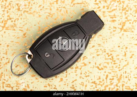 A Mercedes-Benz key fob laying on a wood surface Stock Photo - Alamy