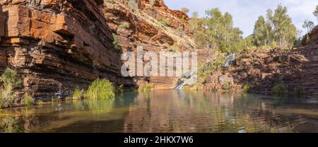 KARIJINI, AUSTRALIA - MAY, 27, 2021: panorama of the natural pool at fortescue falls in karijini national park in wa Stock Photo