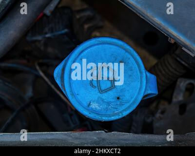 Tank cap for filling the windshield washer of the car. Stock Photo