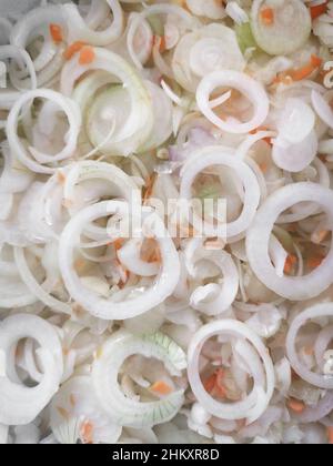Onion rings and carrot slices for cooking. Top view, close-up. Stock Photo