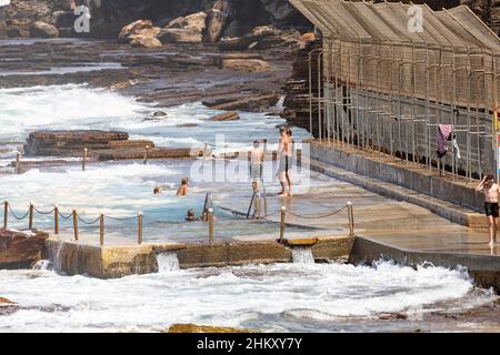 Avalon Beach rock pool swimming pool and teenage boys having fun in the water during summer,Sydney,NSW,Australia Stock Photo