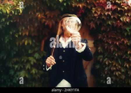 Alchemist in a beautiful ornamental dress in nature. Stock Photo