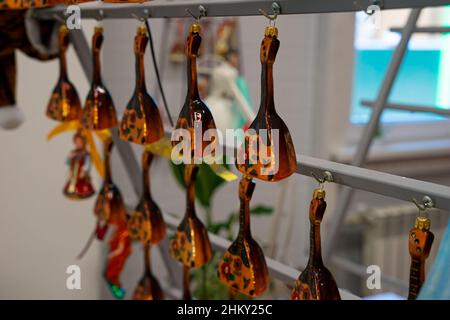 Nizhny Novgorod, Russia. January 03, 2022. Christmas Tree Toys. Glass balalaikas in Russian style. The Factory of Christmas Tree Ornaments Stock Photo