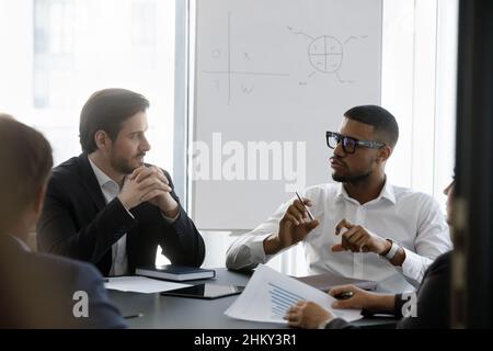 Millennial African American business leader man speaking on meeting Stock Photo