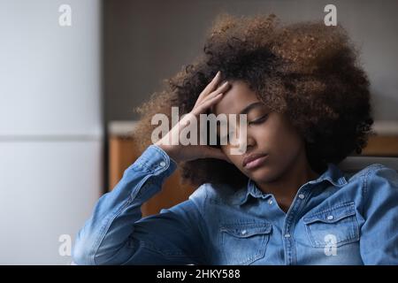 Frustrated unhappy African teen girl suffering from depression Stock Photo