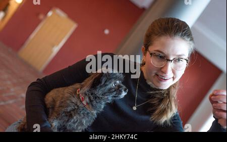 PRODUCTION - 17 January 2022, Mecklenburg-Western Pomerania, Rostock: Maxi Voß with her mongrel dog Gizmo in the Rostock town hall. Photo: Frank Hormann/dpa-Zentralbild/dpa Stock Photo