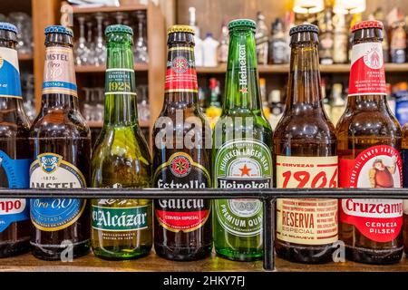 Different types of beer bottles in a Spanish bar Stock Photo