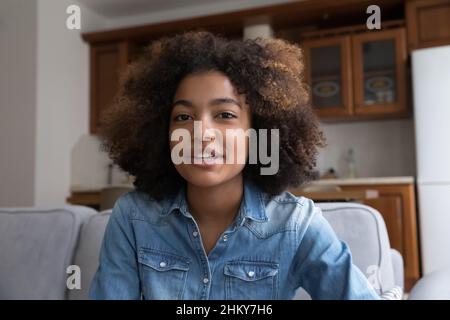 Pretty gen Z African American vlogger girl looking at camera