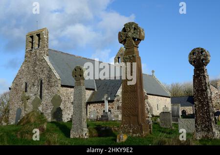 Three old Celtic crosses outside St Bridgets Church St Brides haven Pembrokeshire Wales UK Stock Photo