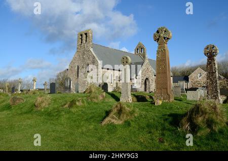 Three old Celtic crosses outside St Bridgets Church St Brides haven Pembrokeshire Wales UK Stock Photo