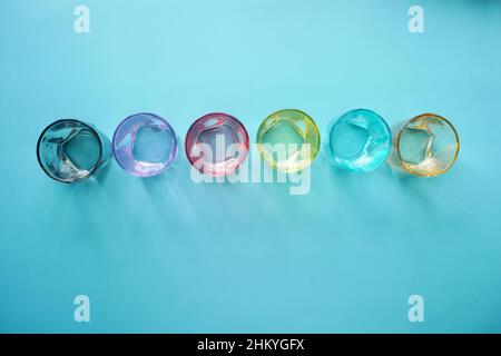 top view of empty drinking glasses on blue background  Stock Photo