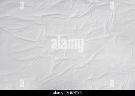 Blank white crumpled creased poster paper. Medium creases. Stock Photo