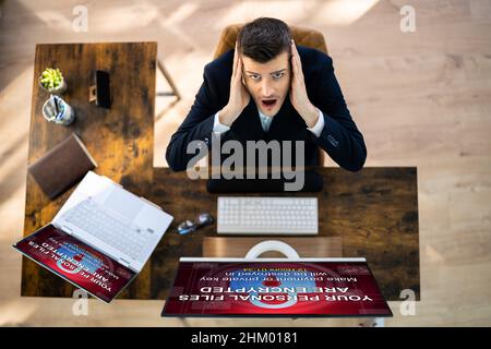 Ransomware Malware Cyber Attack On Business Computer Stock Photo