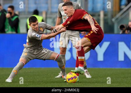 Johan Vasquez of Genoa CFC and Nicolò Zaniolo of AS Roma during football  Serie A Match at Stadio Olimpico, As Roma v Genoa on February 5, 2022 in  Rome, Italy. (Photo by