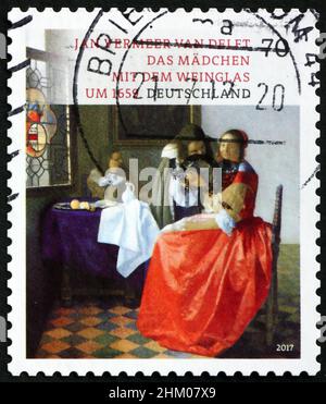 GERMANY - CIRCA 2017: a stamp printed in Germany shows the girl with the wine glass, detail of painting by Jan Vermeer, treasure of German museums, ci Stock Photo