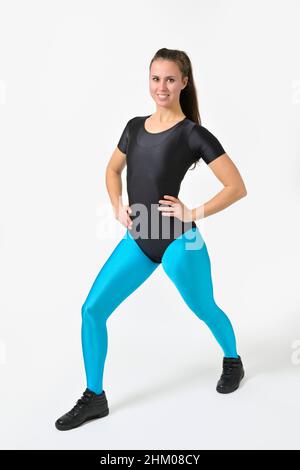 Woman doing stretching. Wearing shiny spandex leotard and leggings, 80s/90s  style Stock Photo - Alamy