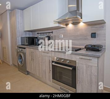 Kitchen And Counter With Built In Appliances In Modern House Stock ...
