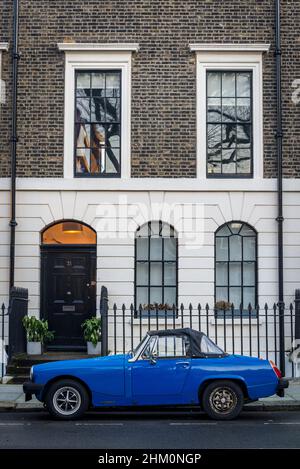 Sports car parked in front of a Georgian house on Trinity Church Square, Southwark, London, England, UK Stock Photo