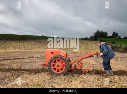 Lisselan, Clonakilty, Cork, Ireland. 06th February, 2022. Francis Naughton from Kilkee, Co. Clare with his vintage British Anzani Iron Horse taking part in the Clodagh annual ploughing match that was held on the lands of the Twomey Family, Lisselan, Co. Cork, Ireland. -  Credit; David Creedon / Alamy Live News Stock Photo