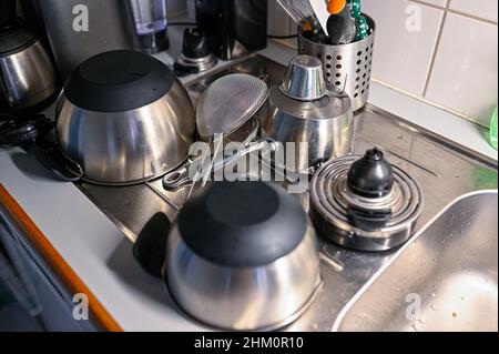 kitchen ware standing on sink drying afterwashing Stock Photo