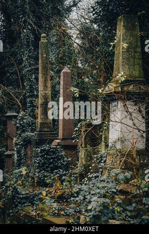 Dilapidated overgrown gravestone, Nunhead Cemetery, London, England, UK Stock Photo