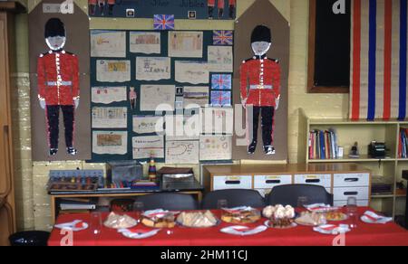 1977, historical, English village primary school, painting and drawings by the school children on the wall to celebrate the silver jubilee of Her Majesty, Queen Elizabeth II. Stock Photo
