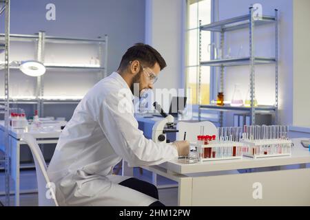 Male laboratory assistant do research in lab Stock Photo