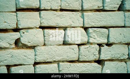 Fresh colored old broken brick, cement joints, close-up. crumbling from old age. construction, repair. concept of devastation, decline. High quality p Stock Photo