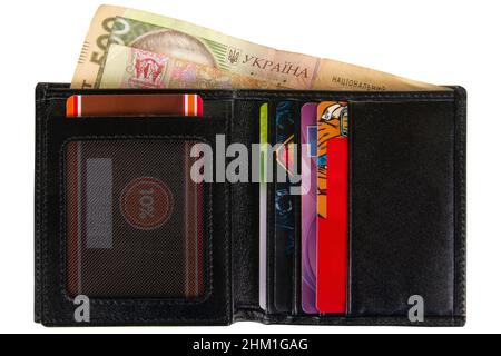 Open black leather wallet with Ukrainian money isolated on white background Stock Photo