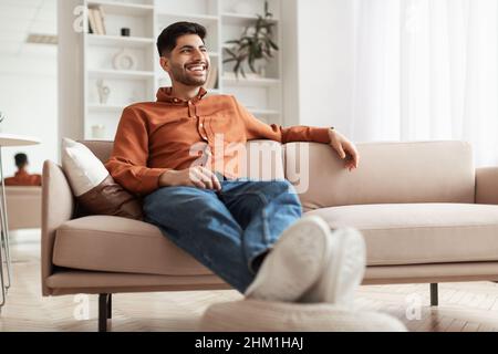 Man having rest at home on the couch Stock Photo