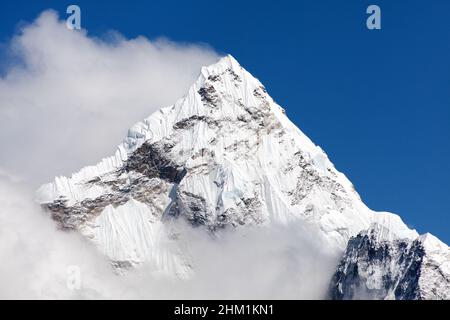 Mount Ama Dablam within clouds, way to Everest base camp, Khumbu valley, Sagarmatha national park, Everest area, Nepal Stock Photo