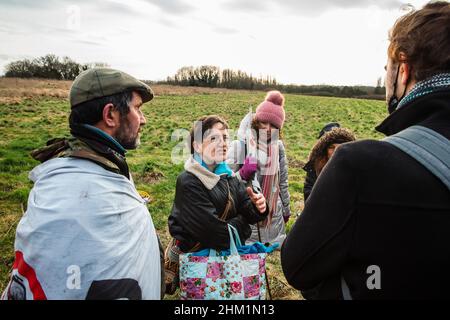 Harefield, UK. 5th February, 2022. Sarah Green (c) is interviewed on Harefield Moor during a March for Water protest walk by Stop HS2 campaigners to highlight the risk of contamination to the public drinking water supply from drilling into the chalk aquifer in the Colne Valley for the HS2 high-speed rail link. Credit: Mark Kerrison/Alamy Live News Stock Photo