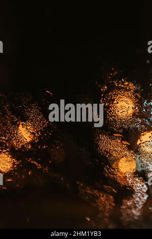 Minimalistic background of water drops over a crystal with color lights reflecting over the texture Stock Photo