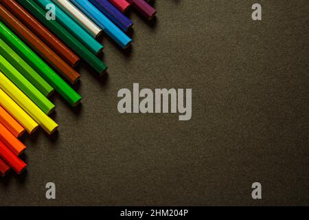 A bunch of tidy pencils on the left corner of the photo Stock Photo
