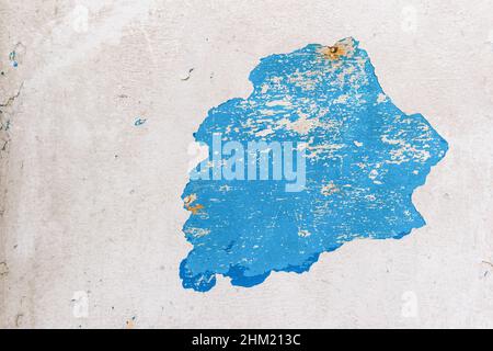 Cracked wall with old layers of paint in abandoned house Stock Photo