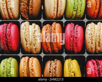 Colorful macarons in a row. Different colorful macaroons in Tasty sweet color - Bakery concept image Stock Photo