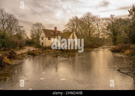 Willy Lott's Cottage at Flatford Mill with an ice covered River Stour, Essex , made famous by William Constable Stock Photo