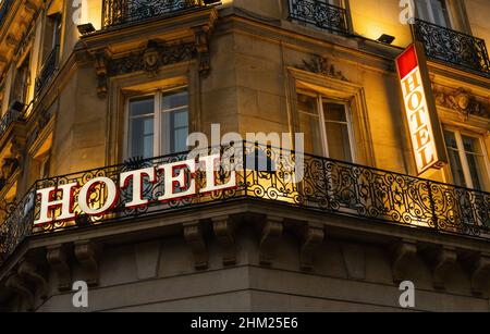 lluminated hotel sign taken in Paris at night Stock Photo
