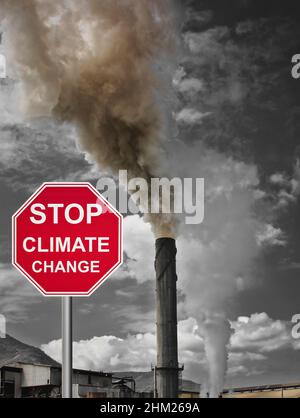 Tully sugar mill in Queensland spewing smoke and pollution into the air and stop climate change sign Stock Photo