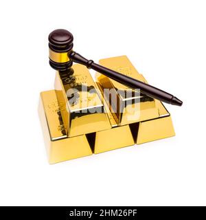 gold bars with wooden auction gavel on white background Stock Photo