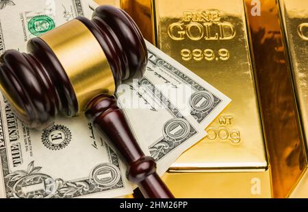 gold bars with american dollar and judge gavel Stock Photo