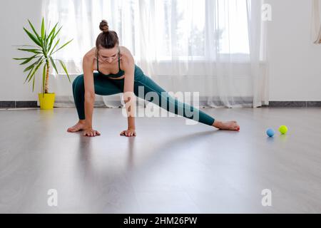 Portret of Young sporty attractive woman practicing yoga, working out Stock Photo