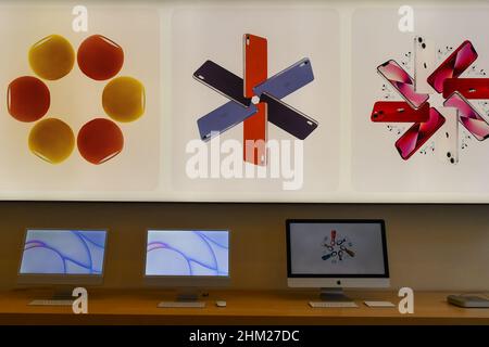 Mac computers displayed inside of the Apple store in Via Roma, in the city center of Turin, Piedmont, Italy Stock Photo
