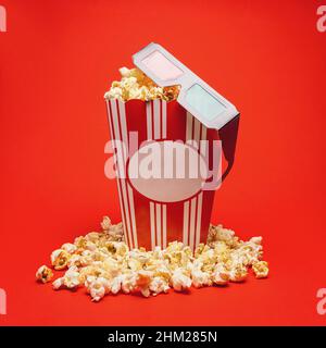 popcorn box with 3D glasses on red background, cinema, movies and entertainment concept image Stock Photo