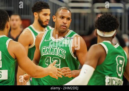 Boston Celtics center Al Horford sits on the bench in street clothes during  the first half of an NBA basketball game against the Cleveland Cavaliers,  Wednesday, Jan. 23, 2019, in Boston. (AP Photo/Mary Schwalm Stock Photo -  Alamy