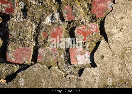 Closeup of red old laid bricks with rough surface Stock Photo